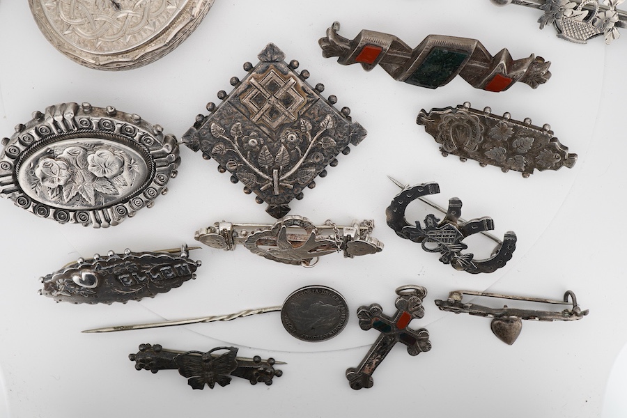 Ten assorted late 19th/early 20th century silver brooches, including three with names, Baby, Millicent and Ellen, together with five other white metal brooches including Scottish hardstones, a coin set stick pin, hardsto